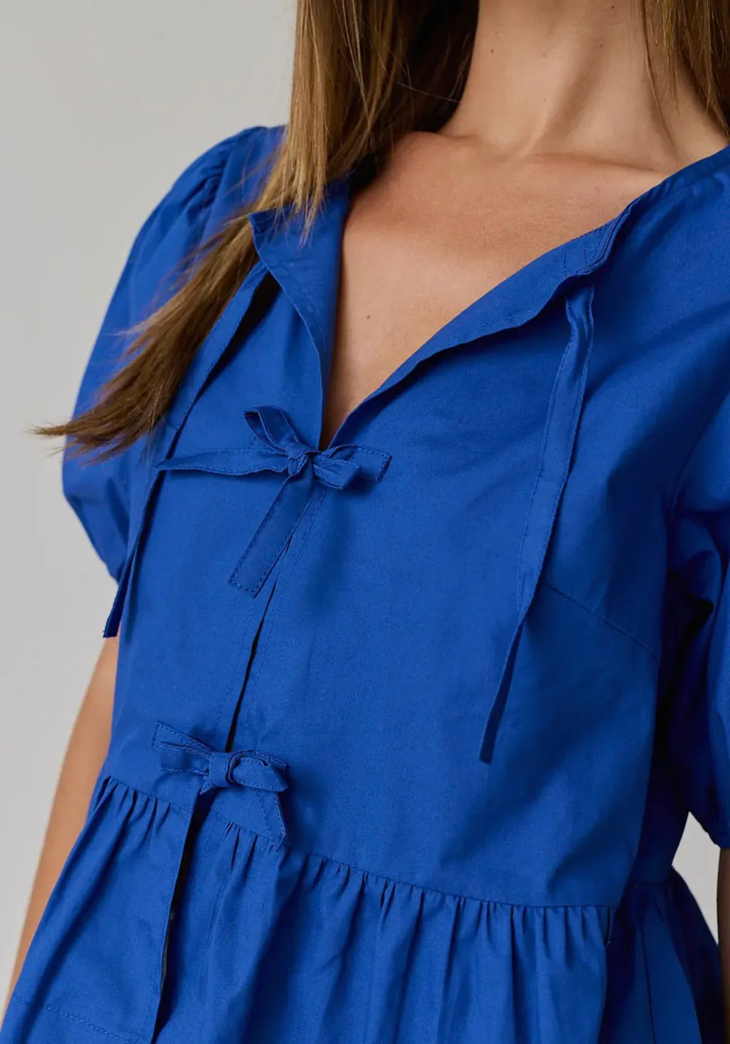 Atlas bow peplum top in blue
